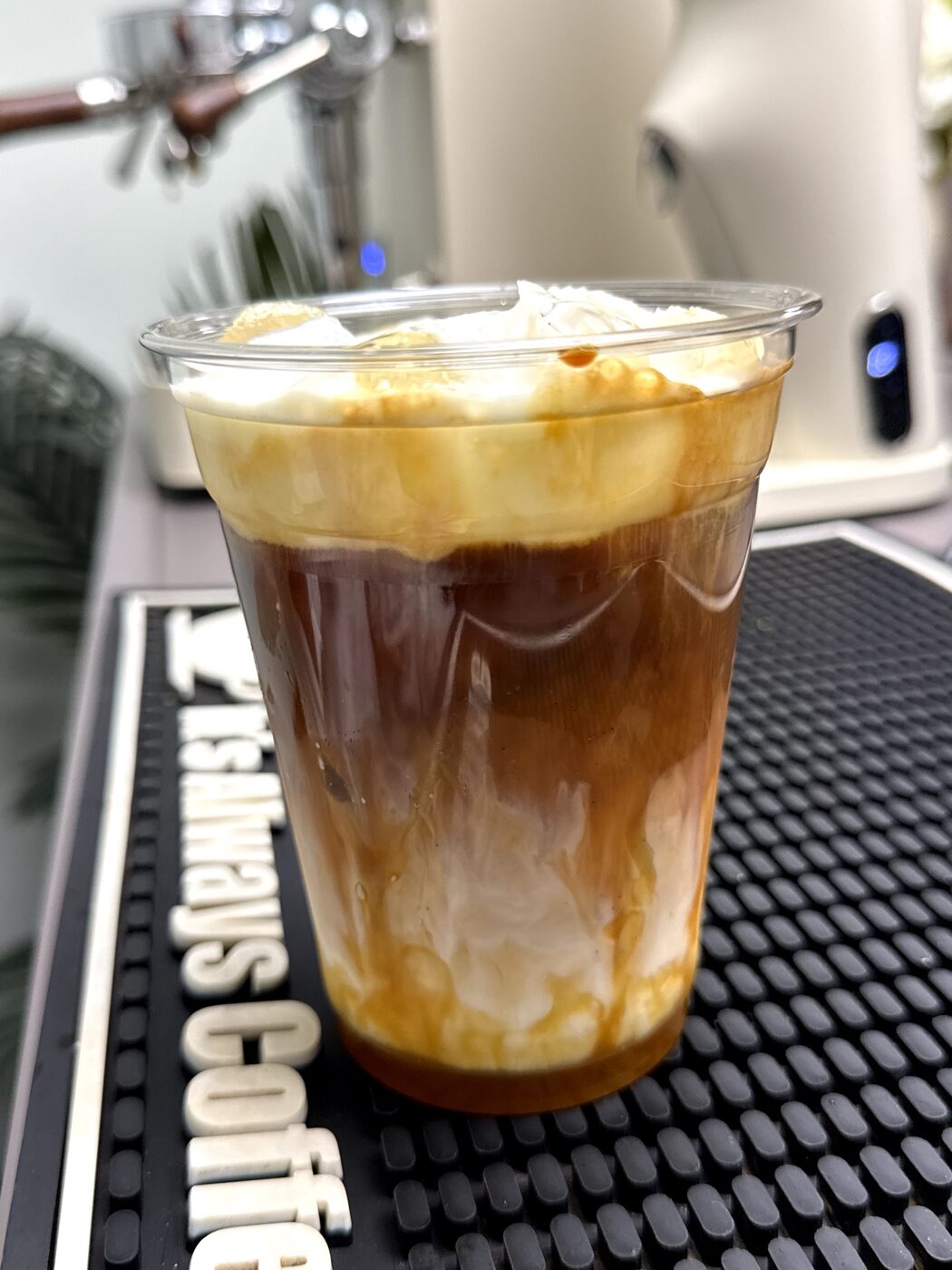 An iced caramel coffee made at the bar