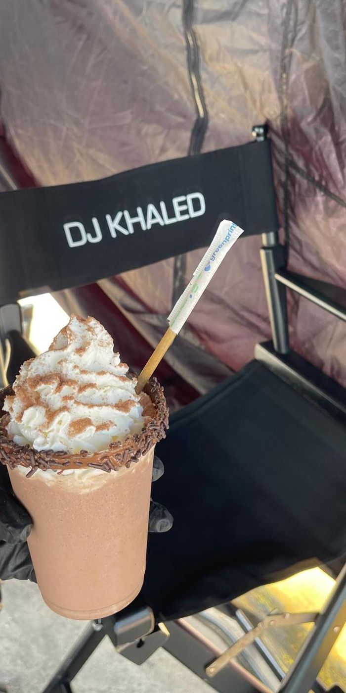 A signature shake on a director's chair